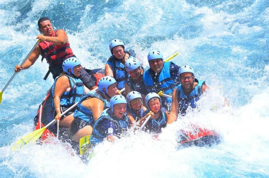 Rafting team cheering at the finish line