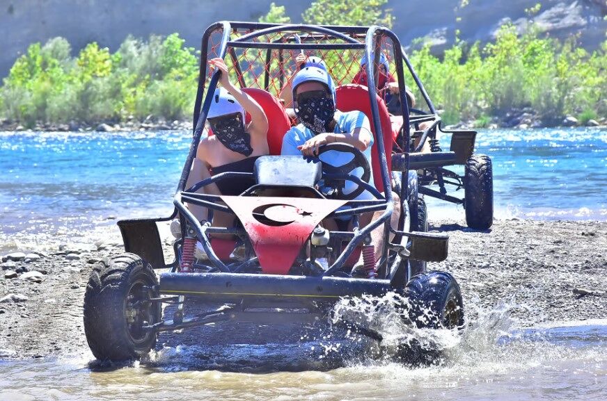 Rafting team conquering a rapid