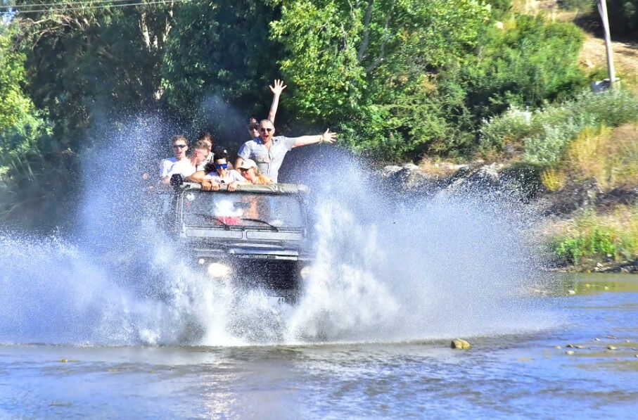 Rafting team celebrating a successful run